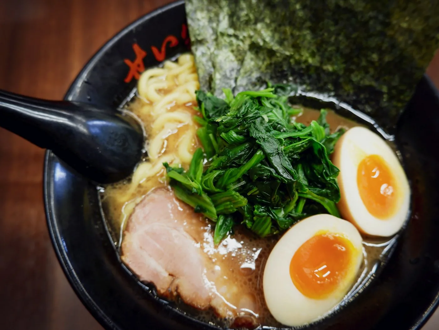 Kumo tonkotsu with chashu, two marinated eggs, greens and nori