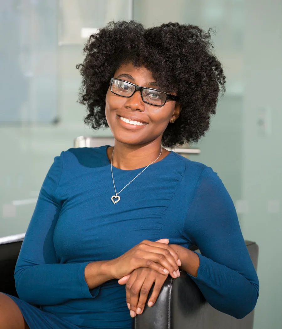 Portrait of Adaeze Okafor smiling in a bright office