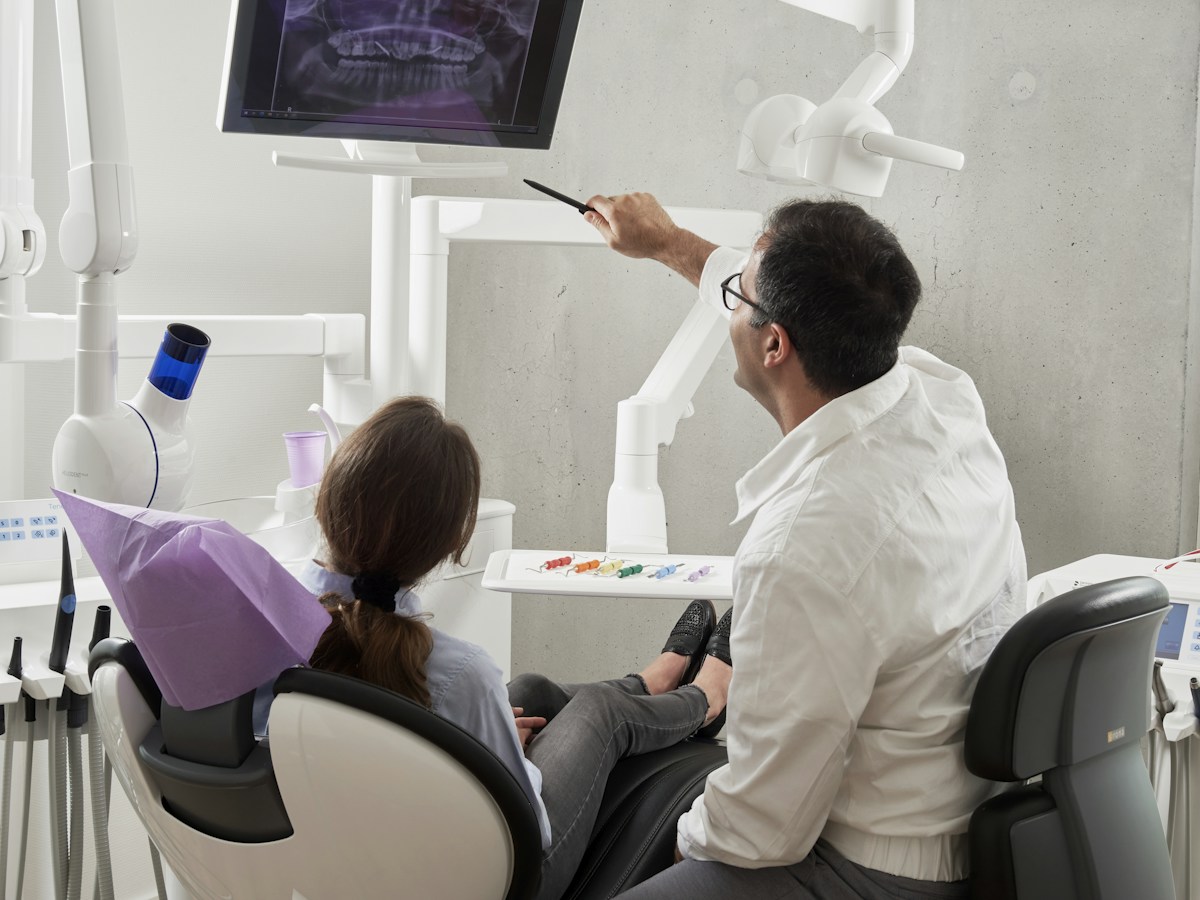 A dental professional caring for a patient