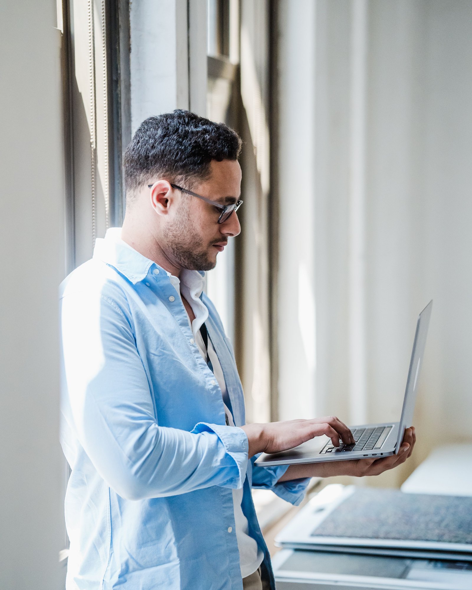 A professional focused on work at a desk